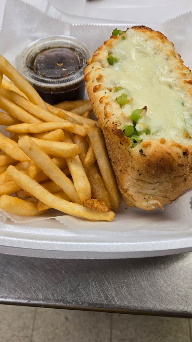 A hot brick-oven sandwich served with French fries