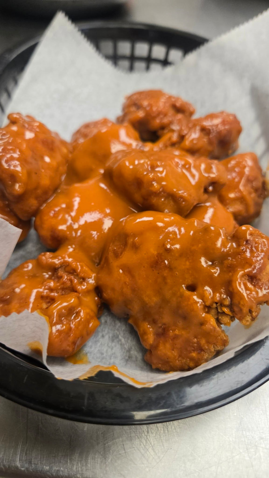 Boneless wings in a glossy orange sauce