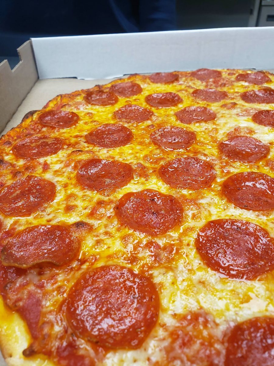 Pepperoni pizza fresh in its takeout box