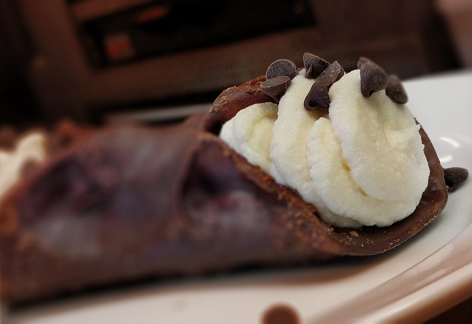 Chocolate-dipped cannoli with cream filling